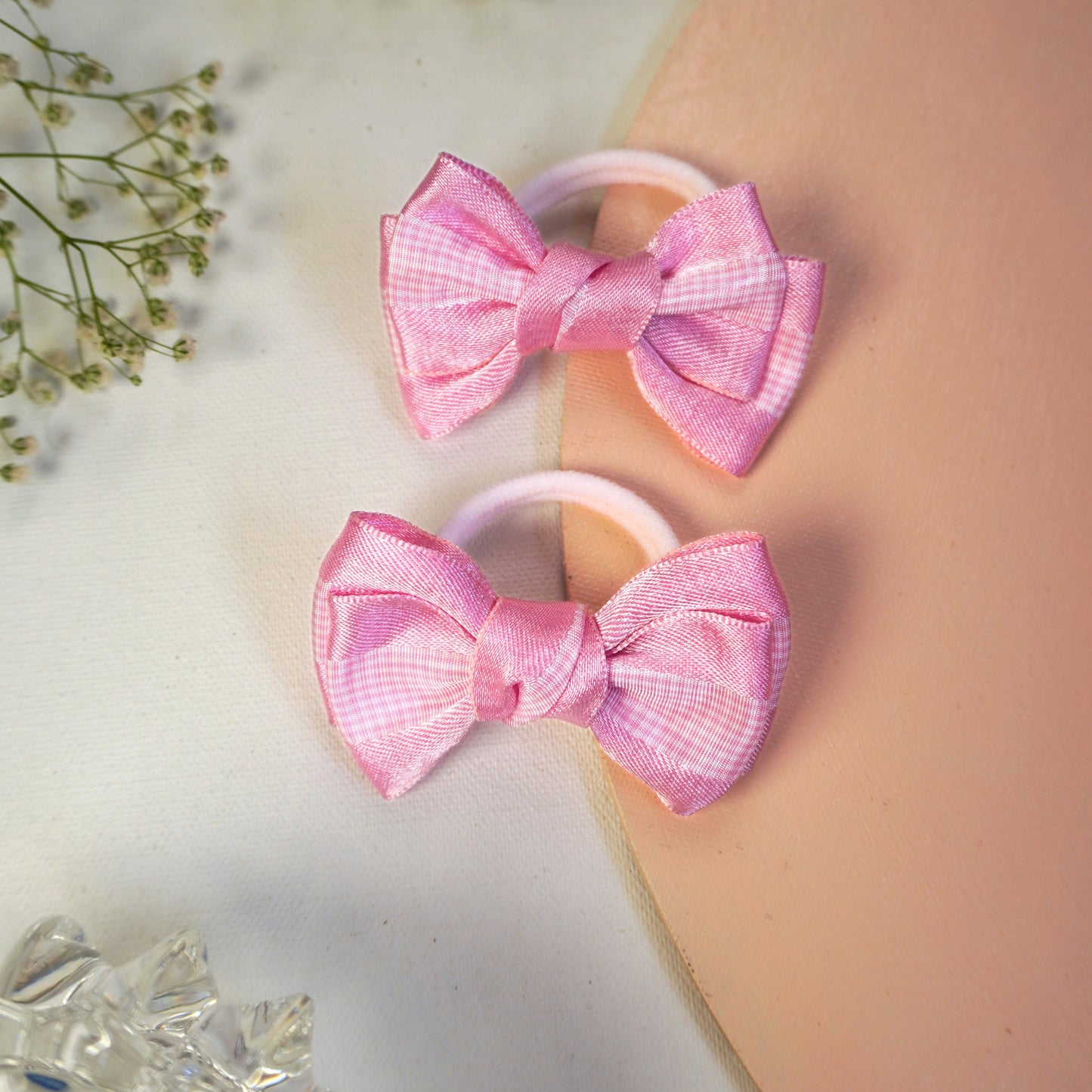 Pink gingham satin bow hair tie duo on elastic band for toddlers and little girls