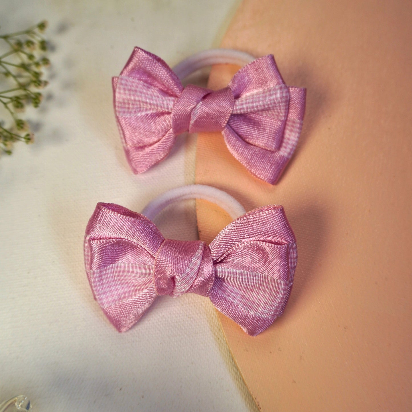 Close-up of pink checkered satin bow hair ties showing glossy texture and neat stitching – Tesral Accessories