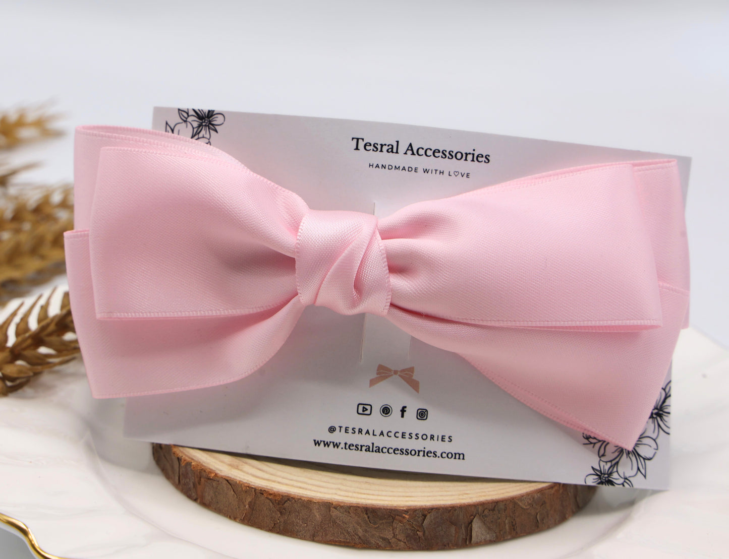 Close-up of Tesral Diana Bow in Pearly Pink, detailing the lustrous pearly satin fabric and neat triple-layer construction.