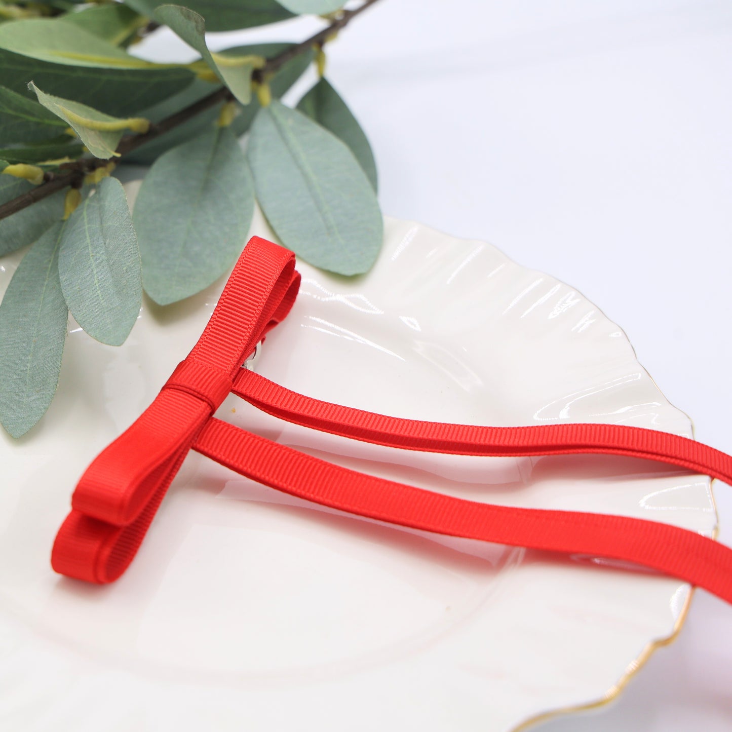 Close-up of Tesral Ethereal Red Hair Bow, showing crisp details of vibrant red grosgrain ribbon hair bow