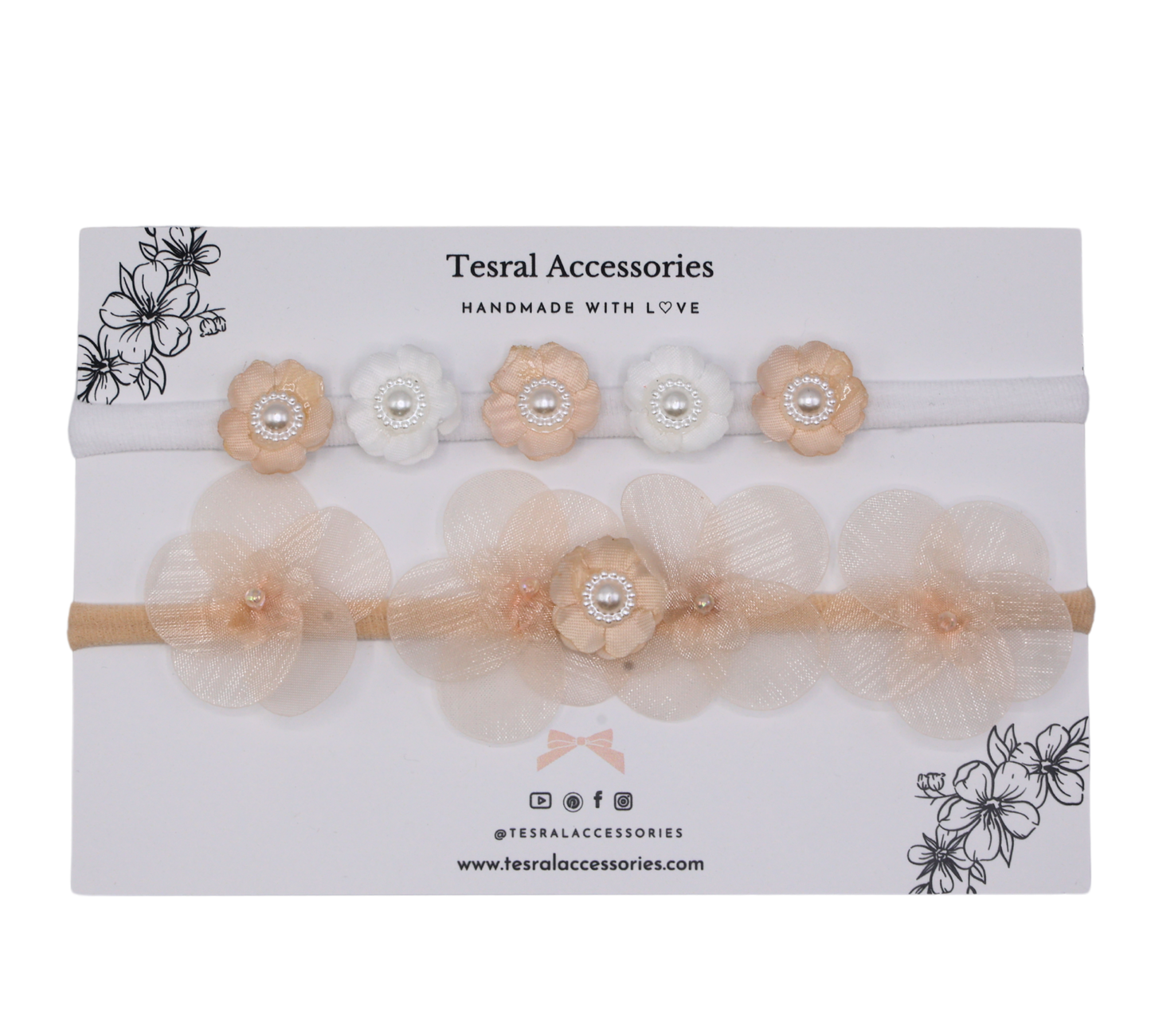 Close-up of Set of two peach petals and white blossoms with pearls on Tiara Bloom headbands.
