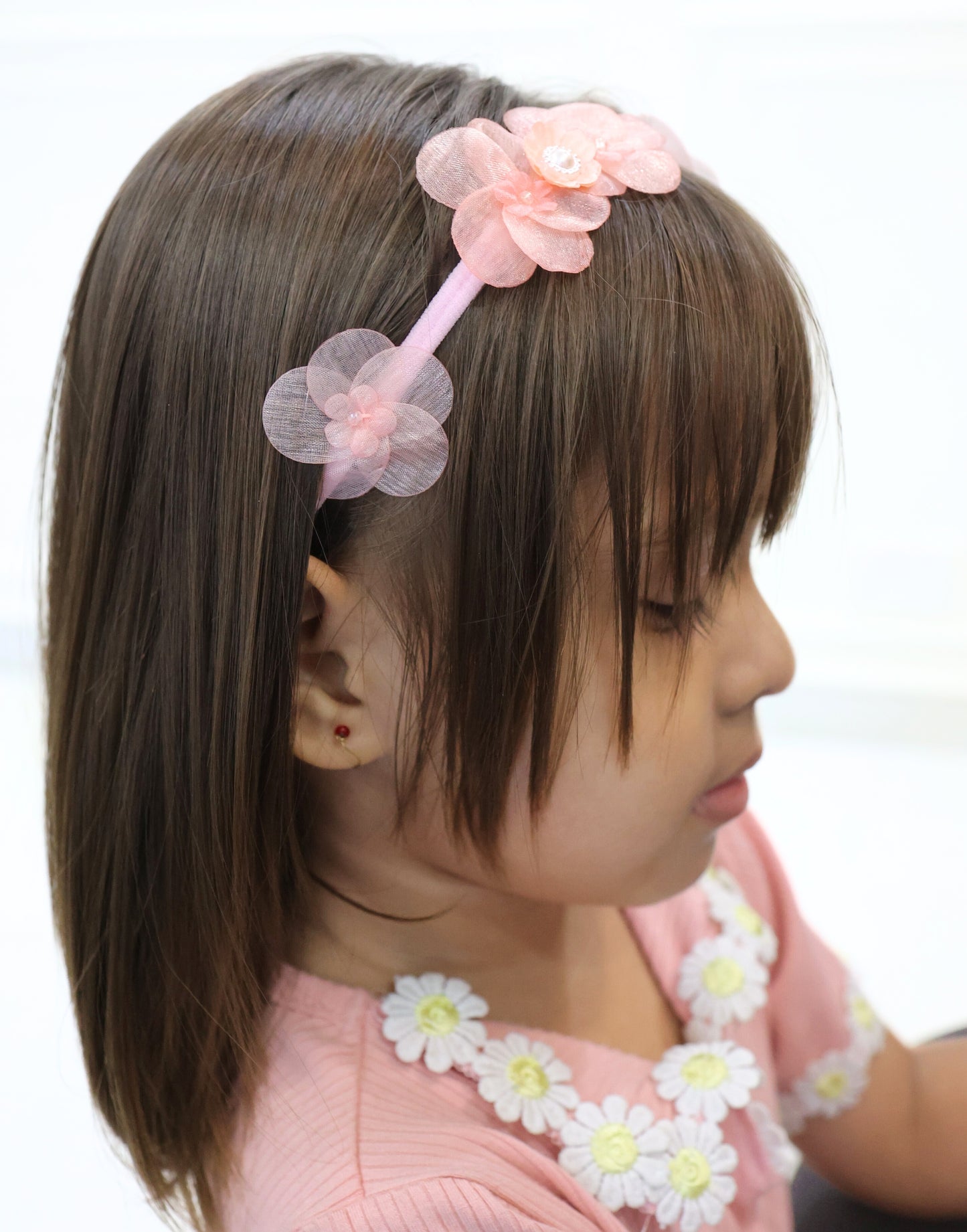 Little girl wearing Tiara Bloom Pink set – soft and elegant headbands by Tesral Accessories