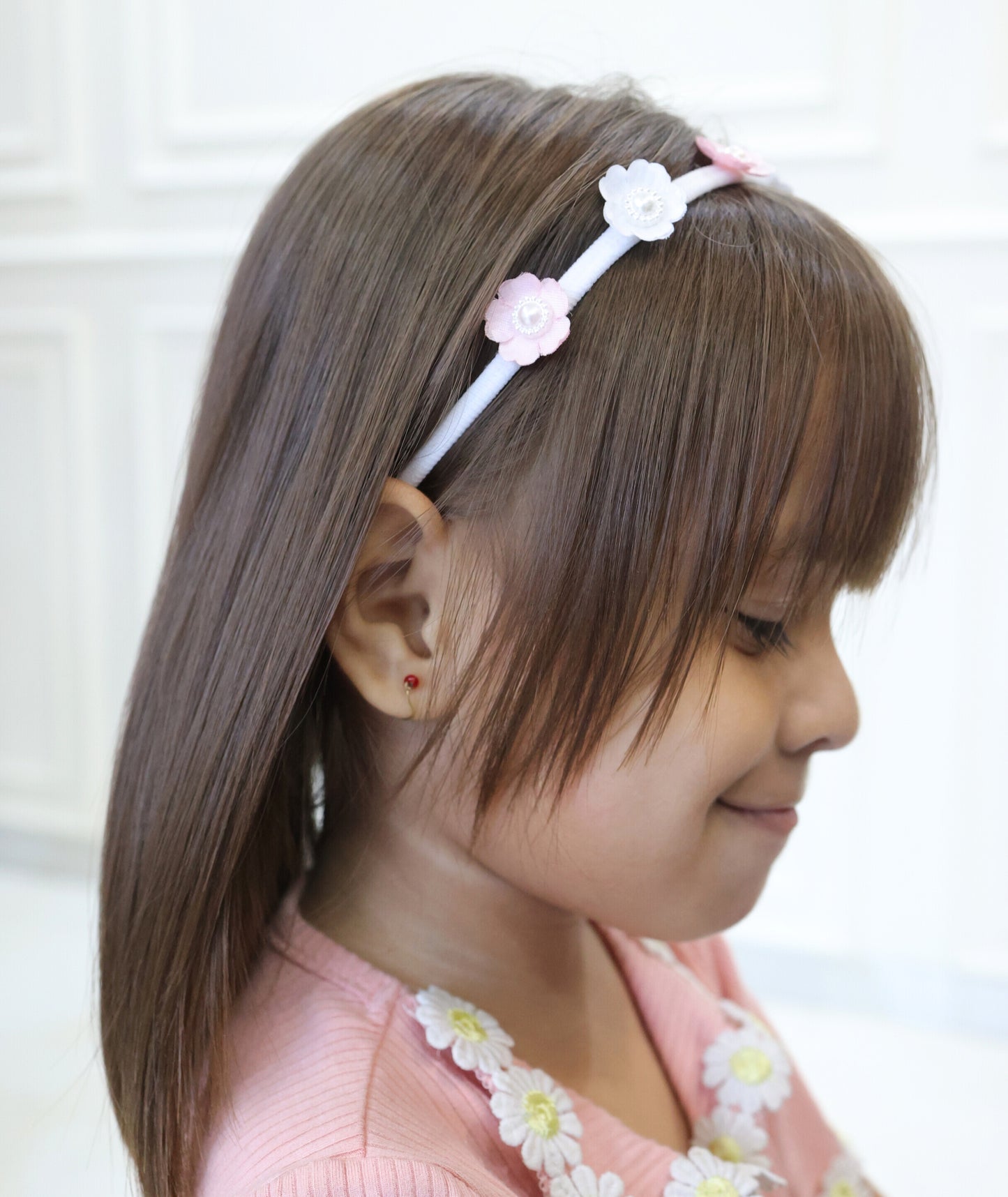 Little girl wearing Tiara Bloom White headband – delicate occasion headwear by Tesral Accessories