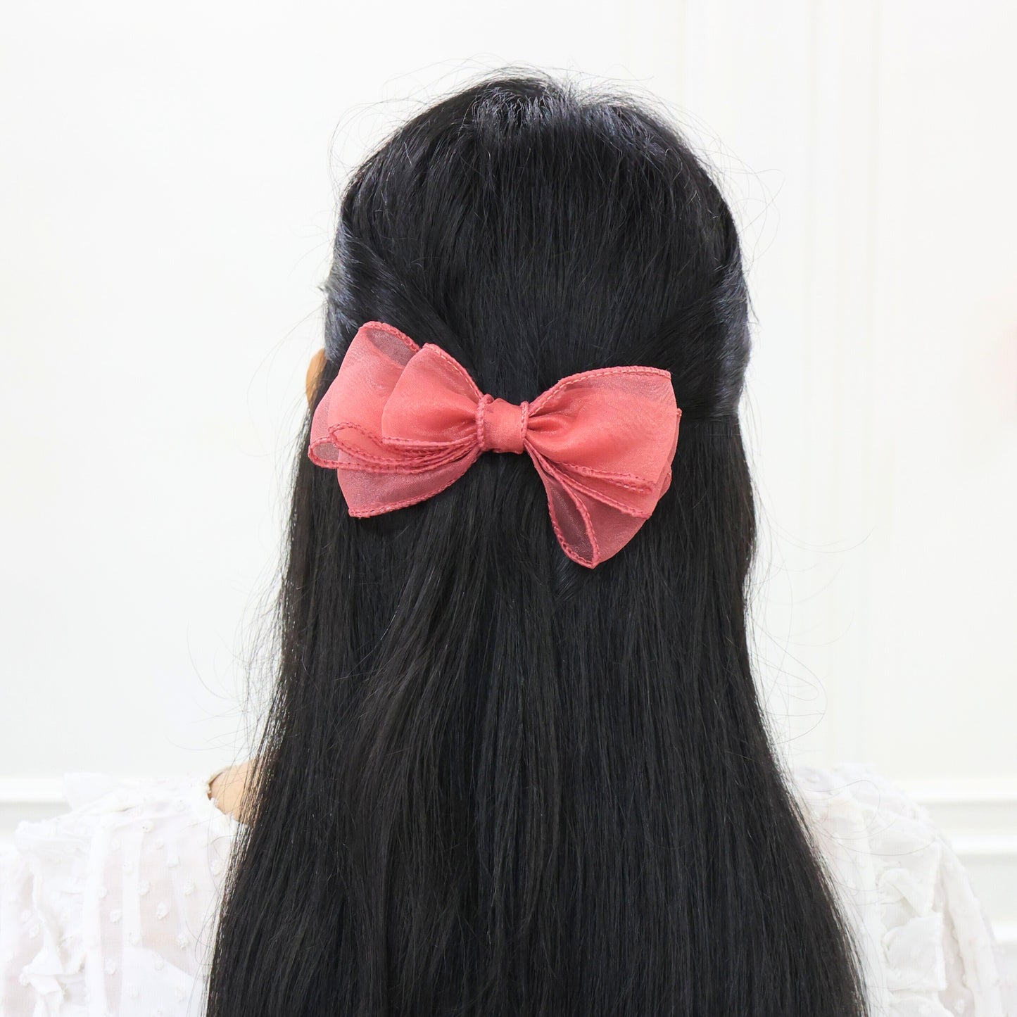 Model wearing Glow Bow – ethereal sheer hair accessory for special events by Tesral Accessories