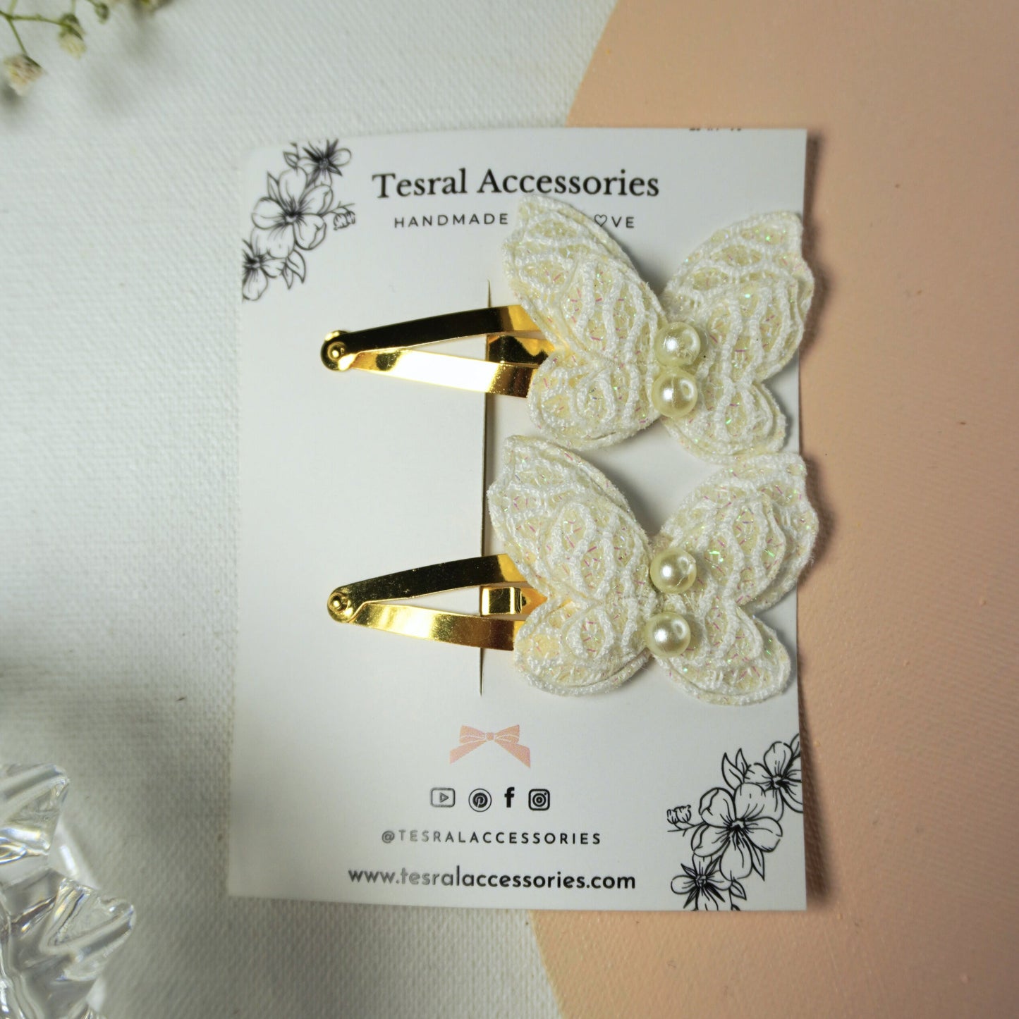 Gold tic-tac clips with delicate white butterfly appliqués for special occasions