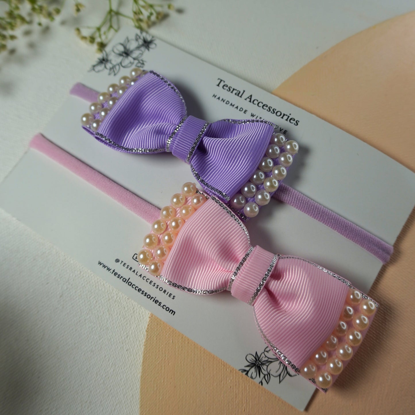 "Set of two lavender and pink silk bow baby headbands with heavy pearl trim