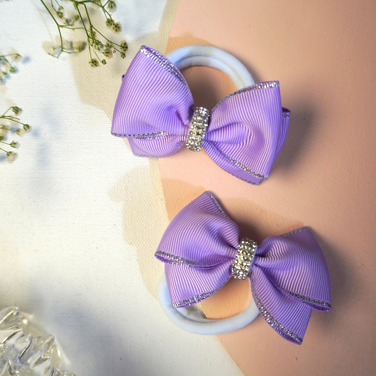 Elegant lilac bow hair ties for girls and toddlers with shimmering silver trim and rhinestone detail – pair by Tesral Accessories