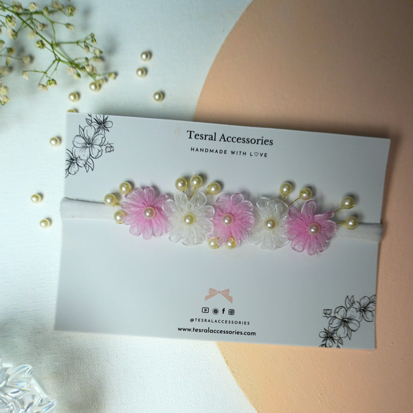 Single pink and white delicate fabric flower headband with pearl details for baby