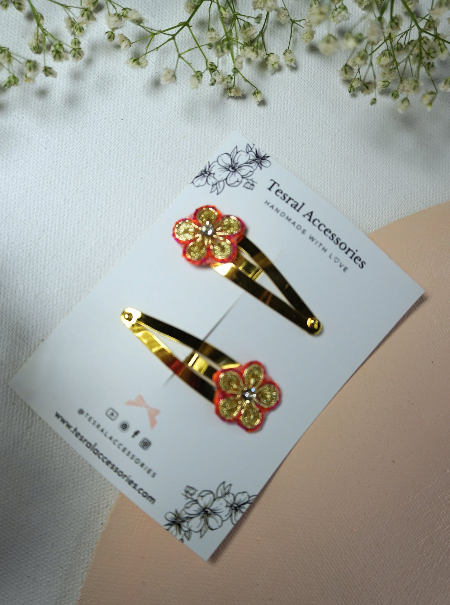 Red and gold Gotta Patti floral hair clips for girls set on golden snap clips