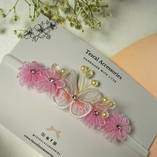 Delicate pink floral and white butterfly baby headband with pearl accents