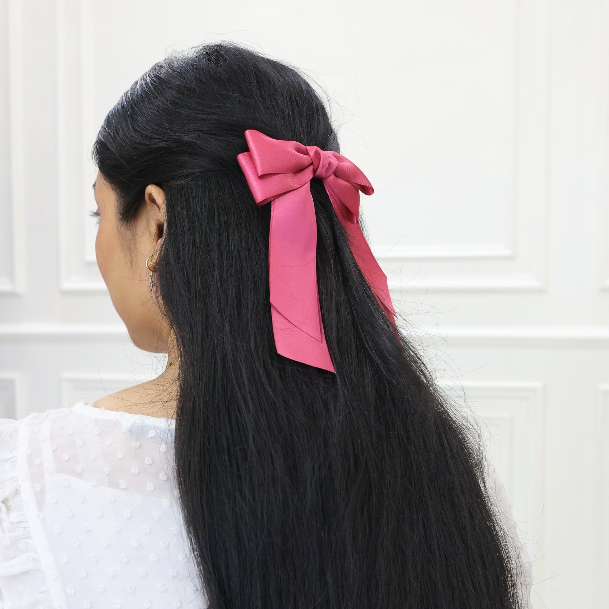 Model wearing Tesral Cascade Colonial Rose Hair Bow, showcasing refined vintage charm and elegant drape in hair.