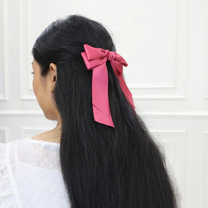 Model wearing Tesral Cascade Colonial Rose Hair Bow, showcasing refined vintage charm and elegant drape in hair.