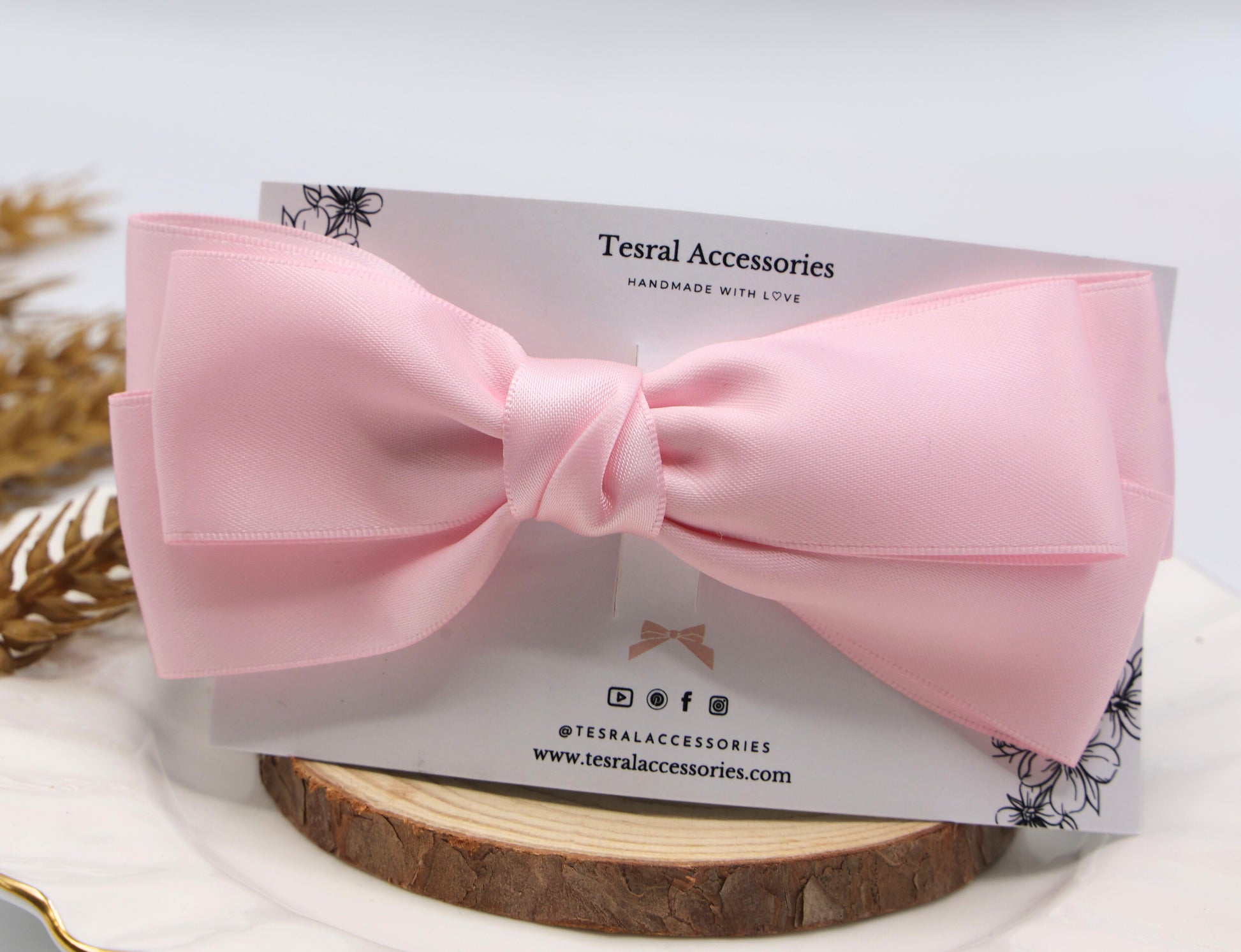 Close-up of Tesral Diana Bow in Pearly Pink, detailing the lustrous pearly satin fabric and neat triple-layer construction.
