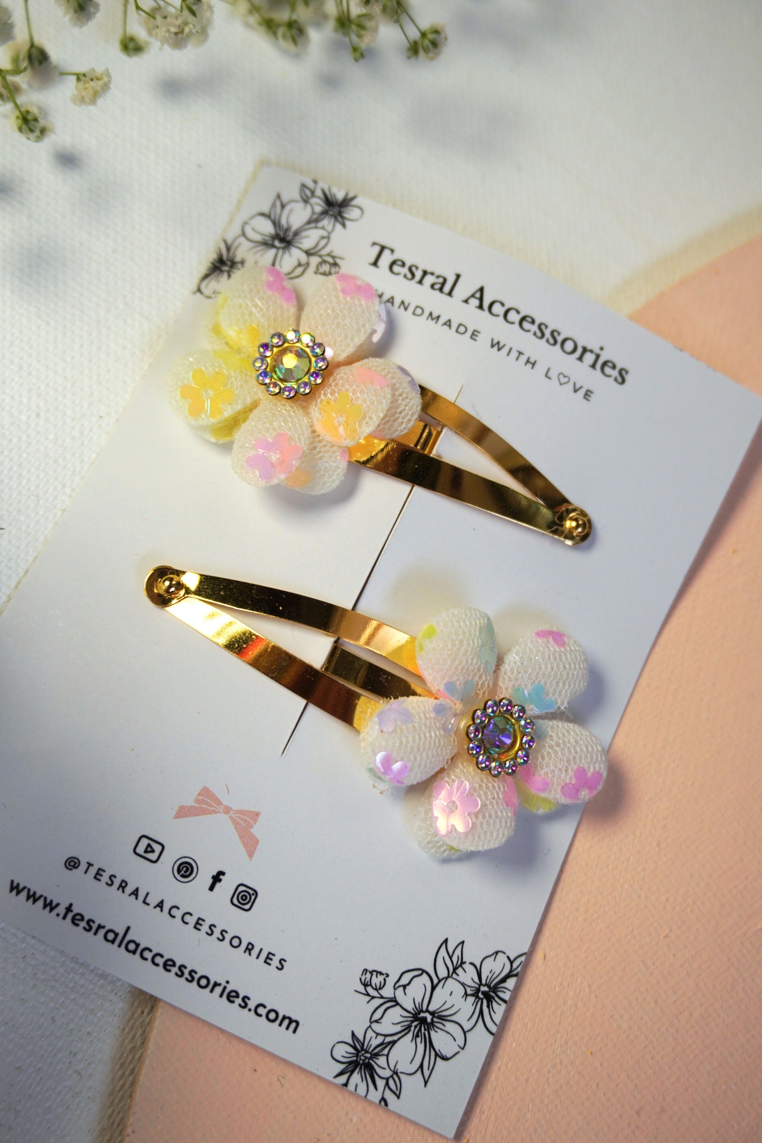 Close-up of Tesral Accessories Dreamy Glow floral clips with iridescent flower sequin and rhinestone center