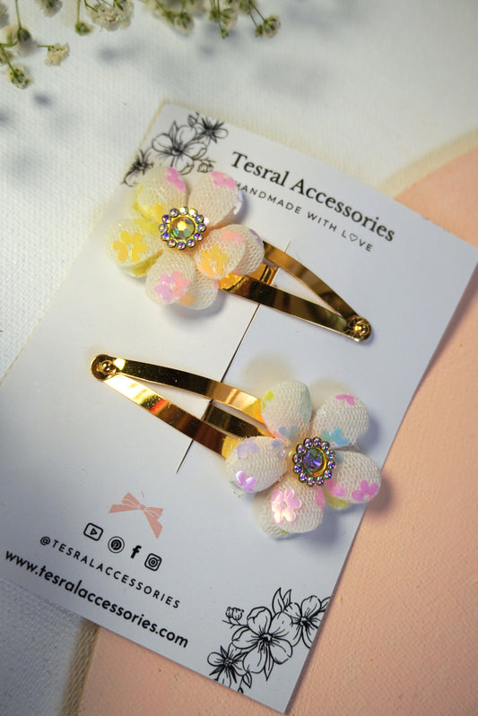 Close-up of Tesral Accessories Dreamy Glow floral clips with iridescent flower sequin and rhinestone center