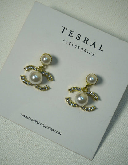 Chanel inspired Pearl earrings on a Tesral Accessories card.