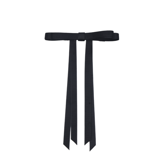 Close-up of Tesral Ethereal Black Bow, detailed view of sleek black grosgrain ribbon and secure French barrette.