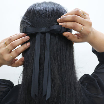 Model wearing Tesral Ethereal Black Bow, demonstrating elegant and structured look for sophisticated office or daily wear.