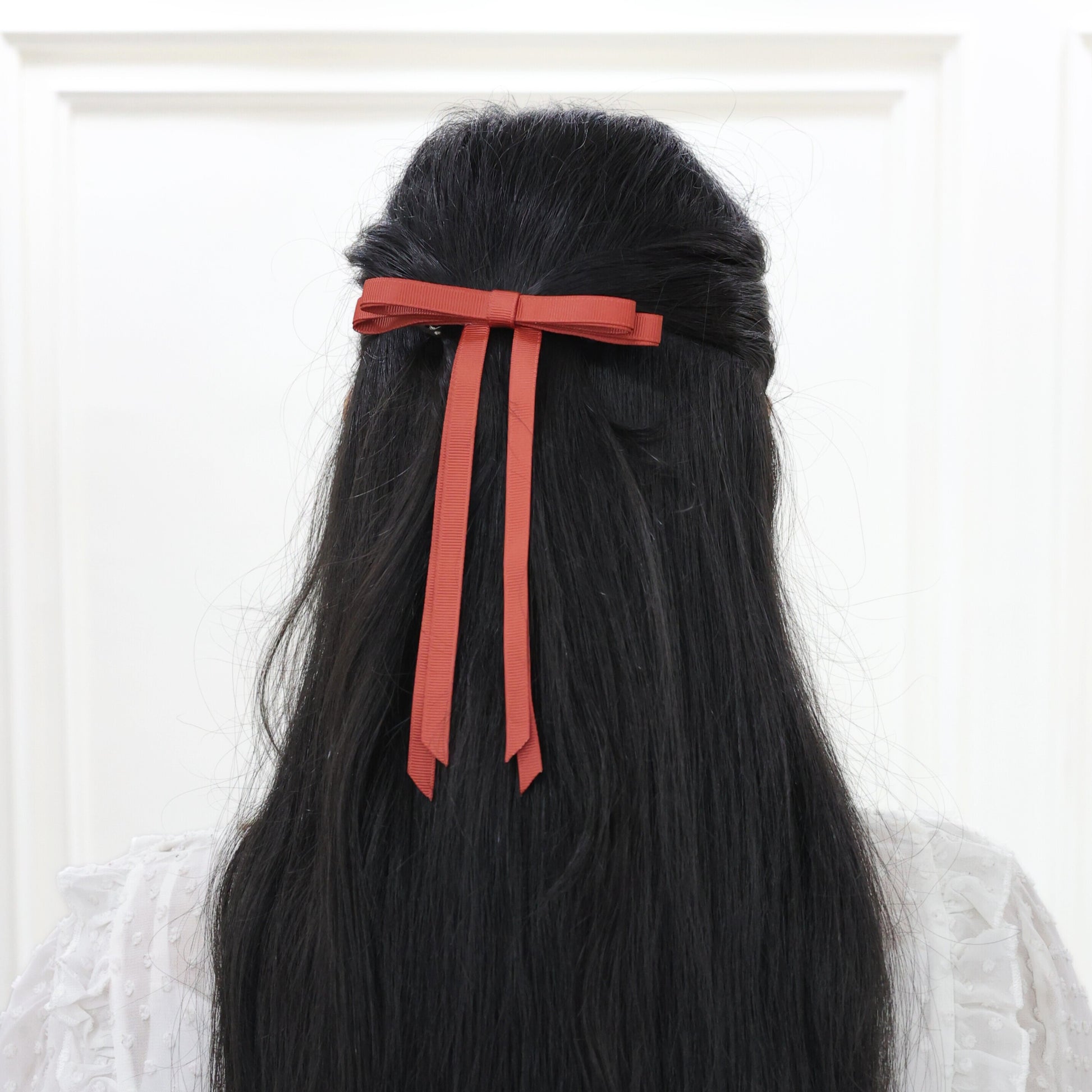 Woman styling Ethereal Rust grosgrain bow – bold yet graceful women hair bow set on French barrette by Tesral Accessories