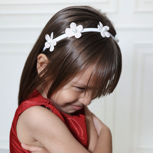 Little girl wearing Fairy Frost Headband by Tesral Accessories – dreamy floral headwear for baby shoots or birthdays

