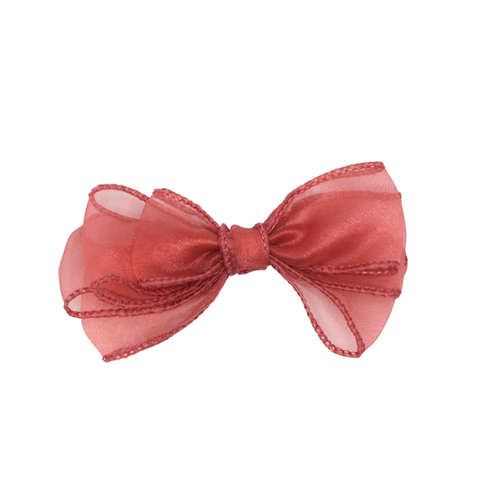 A peachy mauve organza hair bow with a French barrette