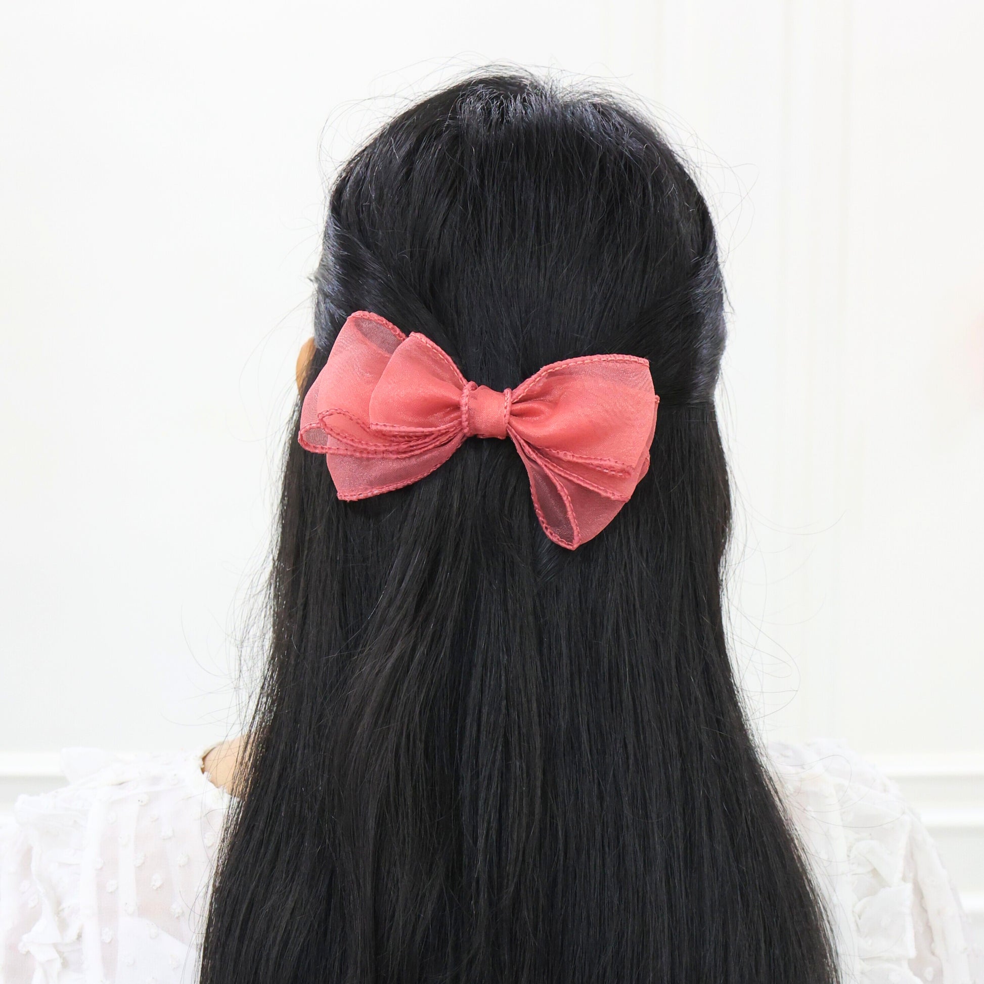 Model wearing Glow Bow – ethereal sheer hair accessory for special events by Tesral Accessories