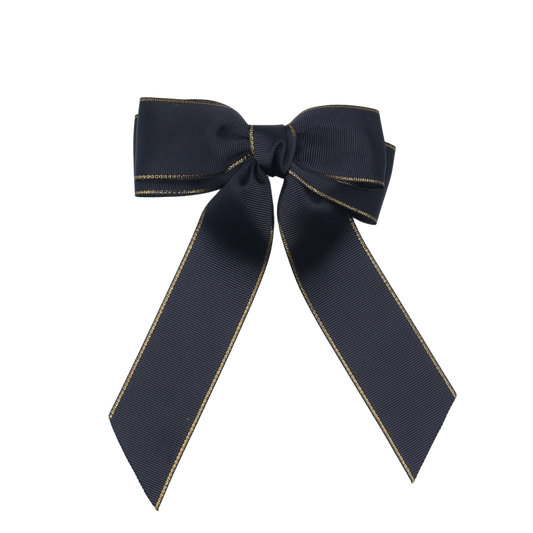 Close-up of Golden Grace Bow's gold-trimmed edges and grosgrain texture for refined hair styling