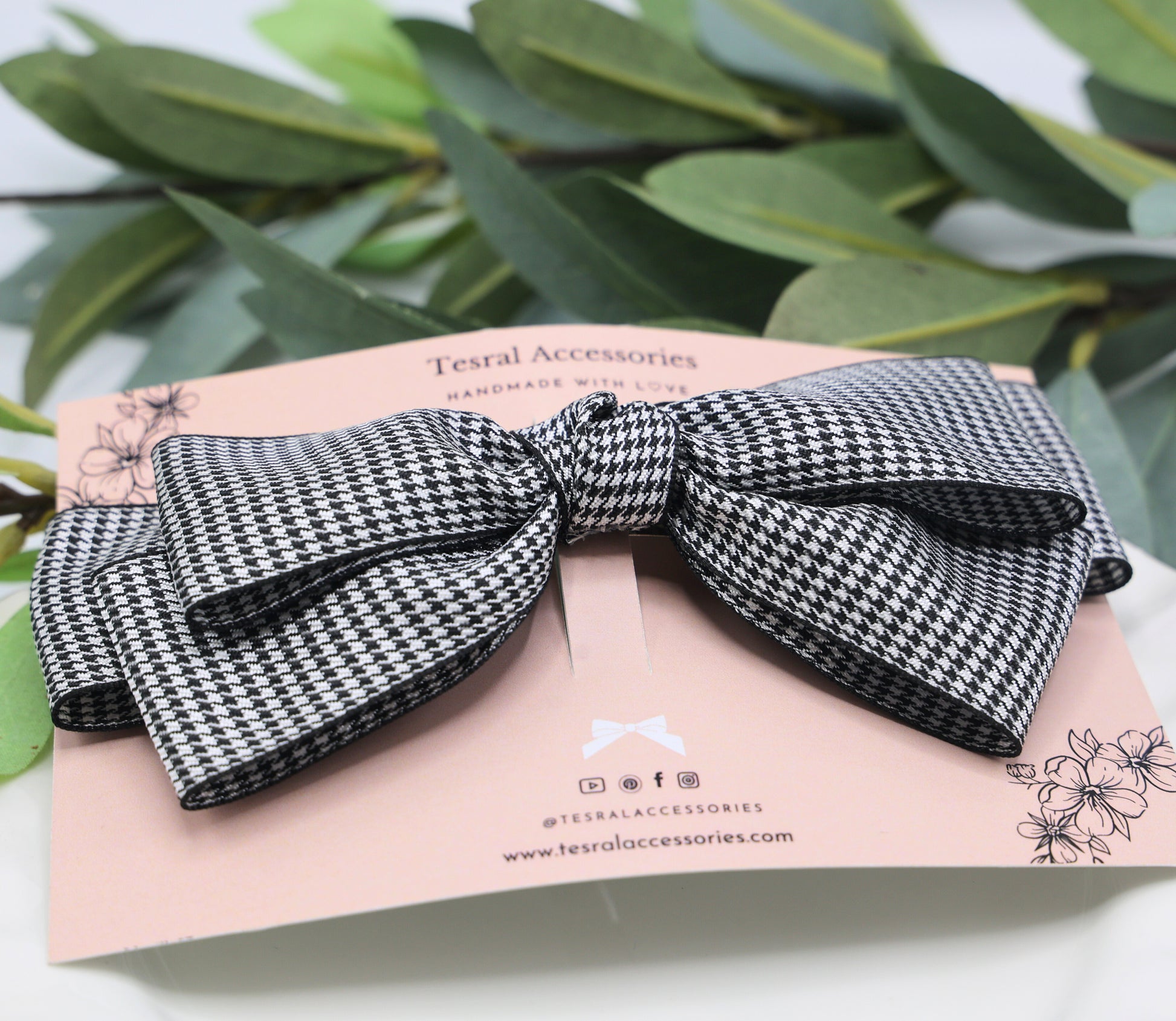 Close-up of Lady Houndstooth Hair Bow showing crisp houndstooth satin fabric and fine triple-layered ribbon detailing with sturdy French barrette clip.