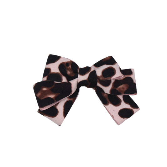 Detailed close-up of Leopard Luxe Hair Bow showcasing plush suede texture and wild leopard pattern.
