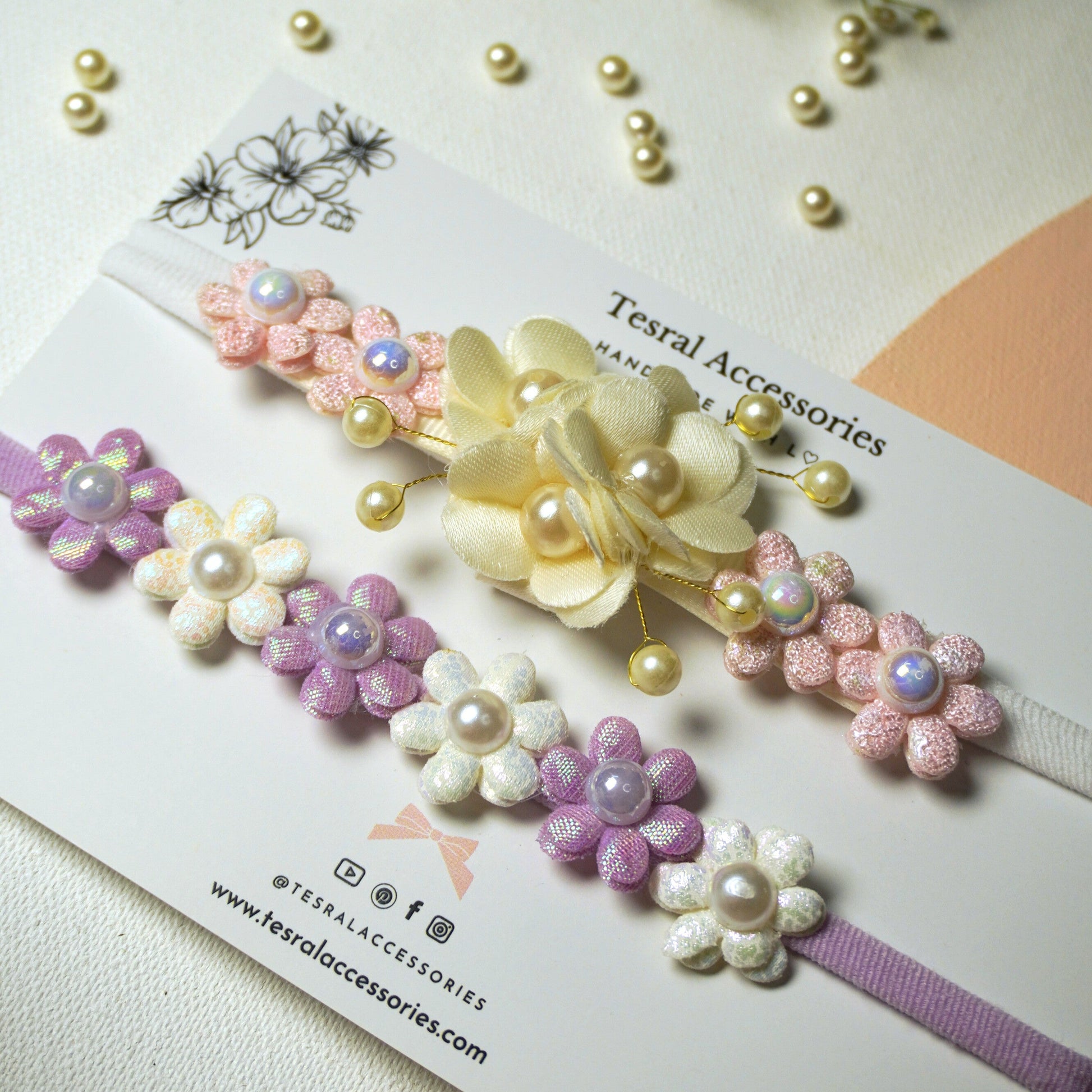 Cream white flower trio headband with pearl accents on soft nylon band