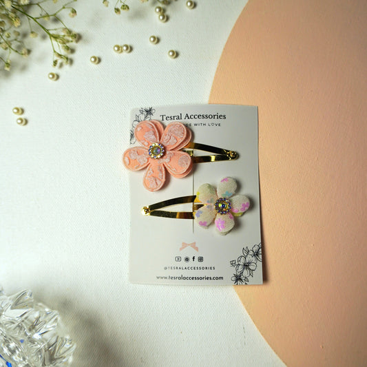 Set of two gold snap clips with peach organza flower and white iridescent flower