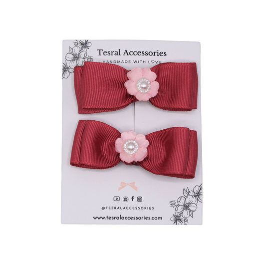 Close-up of Pearly Pink Hair Bow by Tesral, showing detailed flower centerpiece and clean ribbon fold.