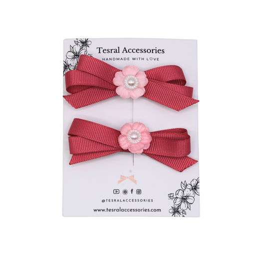 Colonial pink grosgrain ribbon twin bows with flower centerpiece —cute toddler hair accessories.
