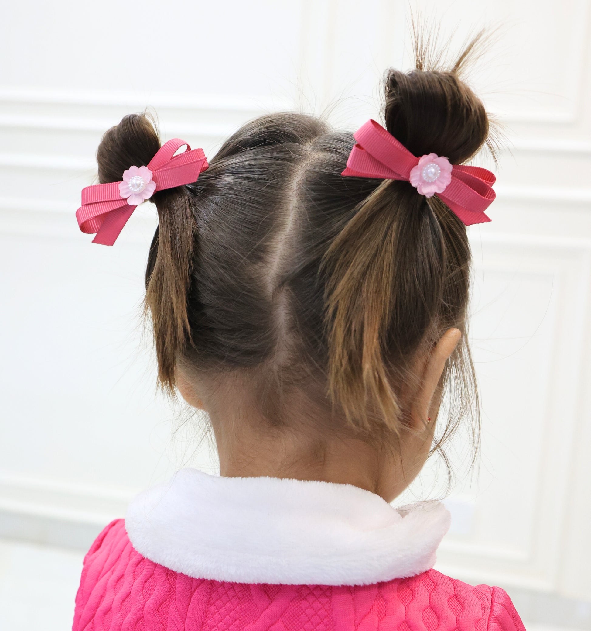 Little girl wearing Pink Picnic hair bow for simple, charming everyday hairstyle.