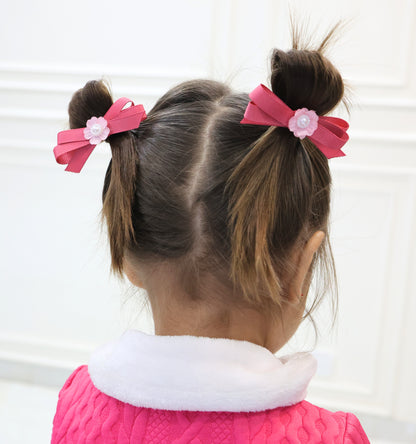 Little girl wearing Pink Picnic hair bow for simple, charming everyday hairstyle.