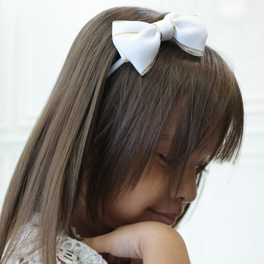 Set of two grosgrain ribbon hair bow headbands for baby girls – white with gold trim and lavender with silver edge by Tesral